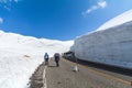 Road between snow wall of Tateyama Kurobe Alpine Route or Japa Royalty Free Stock Photo