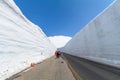 The road between snow wall of Tateyama Kurobe Alpine Route or Royalty Free Stock Photo