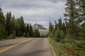 Rocky Mountains. asphalt mountain road on a sunny day. Road with yellow markings. Empty highway in Journey Royalty Free Stock Photo