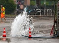 Road spurt water beside traffic cones Royalty Free Stock Photo