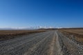 Road steppe mountain snow sky Royalty Free Stock Photo