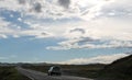 Road in steppe under a blue sky with white clouds Sayan mountains Siberia Russia Royalty Free Stock Photo