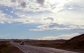 Road in steppe under a blue sky with white clouds Sayan mountains Siberia Russia Royalty Free Stock Photo