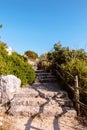 Road with stone steps on top of a mountain to Temple of Jupiter Anxur or Tempio di Giove Anxur, ancient ruins, on top of Pisco Royalty Free Stock Photo