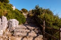 Road with stone steps on top of a mountain to Temple of Jupiter Anxur or Tempio di Giove Anxur, ancient ruins, on top of Pisco Royalty Free Stock Photo