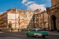 The road and the street in front of the Capitol Nacional, El Capitolio. Green retro car rides on the road. Havana. Cuba Royalty Free Stock Photo