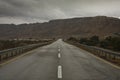 The road stretches among the rocks of the Negev desert