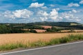 Road in agriculutral fields in late summer in sunny day Royalty Free Stock Photo