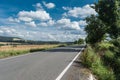 Road in agriculutral fields in late summer in sunny day Royalty Free Stock Photo