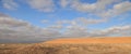 Road at sunset crossing the Karakum desert in Turkmenistan Royalty Free Stock Photo