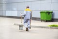 Road sweeper worker cleaning city street