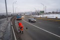 Road sweeper worker cleaning street in orange uniform