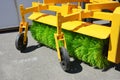 Road sweeper. Yellow street sweeper machine fow washing and cleaning asphalt road Royalty Free Stock Photo