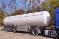 Road tanker with thermal insulation designed for the carriage flammable substances. Truck with a specialist semi-trailer Royalty Free Stock Photo