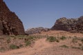 Road thru desert and rocks of Wadi Rum (Valley of the Moon), Jordan. UNESCO World Heritage. Royalty Free Stock Photo