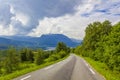 Road thru mountain forest landscape at sunny day Vang Norway Royalty Free Stock Photo