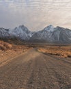 The road to adventure with the Sierra Nevada rising in the background Royalty Free Stock Photo