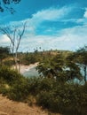 the road to a beautiful beach with an interesting view