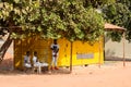 Unidentified local three boys locate near the garage in a villa