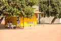 Unidentified local three boys locate near the garage in a villa