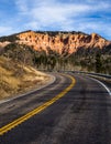 Road to Cedar Breaks, winding highway through Souther Utah red rock cliffs and towers