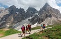 On the road to Cimon della Pala among rugged peaks of Pale di San Martino under sunny sky