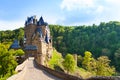 Road to the Eltz castle with towers, in hills