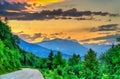 Road to French Alps at sunset in summer Royalty Free Stock Photo