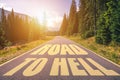 Road to hell written on the street in the mountains. Road to hell text on the highway Royalty Free Stock Photo