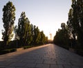 The road to Mamayev Kurgan in Volgograd in the sunset and the silhouette of the monument Motherland calls in the distance