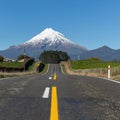 Road to a snow capped mount Taranaki, New Zealand Royalty Free Stock Photo