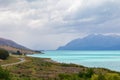 Road to the Southern Alps. Along the shore of the turquoise lake Pukaki. South Island, New Zealand Royalty Free Stock Photo