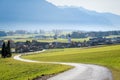 Road to Austrian mountain village with foggy valley background in autumn, Wildermieming, Tirol, Austria Royalty Free Stock Photo