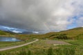 Road to Unstad under colorful Rainbow in Lofoten islands, Norway, selective focus Royalty Free Stock Photo