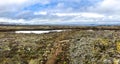 Road to volcano among dry lava, moss, rocks and snow Landmannalaugar landscape Royalty Free Stock Photo