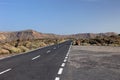 Volcanic desert road highway travel landscape blue sky El Teide volcano Tenerife Spain Canary islands nature trip summer park view Royalty Free Stock Photo