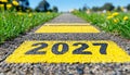 Road to 2027, Yellow Numbers On Asphalt Path Symbolizing Journey, Future, And New Beginnings.