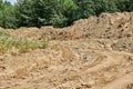 Road with traces of construction equipment of a pile of earth