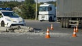 Road traffic cone and police on accident site