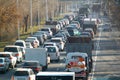 Road traffic congestion. Many different cars are stuck in a traffic jam in a city street. Diagonal view