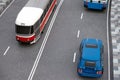 Road traffic miniature with toy models of a modern tram, car and trolley bus