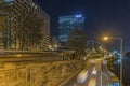 Road Traffic Near La Defense Business District at Night Lights and Shadows Buildings