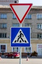 Road traffic sign. Pedestrian crossing sign. Pedestrian crossing in the city. Royalty Free Stock Photo