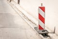 Road traffic sign work ahead with red and white barriers on the street construction site in the city Royalty Free Stock Photo