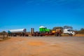 Road Train in Australia carrying another truck and fuel in the Outback Royalty Free Stock Photo