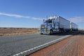 Road train driving in central Australia Outback Royalty Free Stock Photo