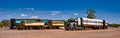 Road train trucks on a parking lot in the Australian desert. Royalty Free Stock Photo