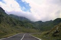 Road on the transfagarastan route in Romania in the summer. There are monutains around it