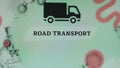 Road transport inscription on light green background with black truck symbol. Transportation concept