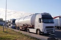 Road transport. Trucks transporting various goods. Photo shows a tanker and a truck for transporting passenger cars Royalty Free Stock Photo